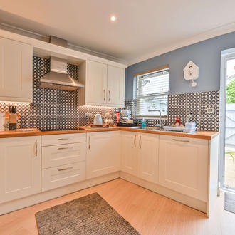 Kitchen with access to the courtyard - Lisburne Place Luxury self catering accommodation in Torquay.